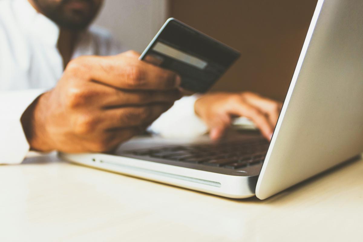 A person holding a set of keys unlocking a digital marketplace with the word 'Fiverr Gig Keyword Strategy' in the background.